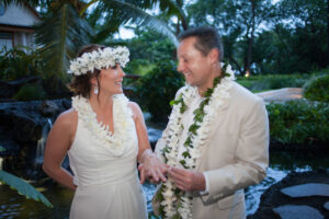 Couple with flower crowns and leis